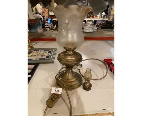 A BRASS OIL STYLE LAMP WITH FLUTED GLASS SHADE AND A MINATURE EXAMPLE 