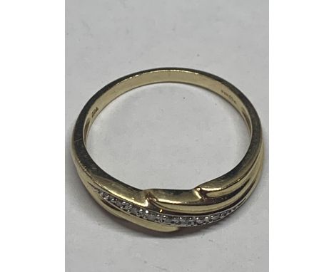 A 9 CARAT GOLD RING WITH A LINE OF DIAMONDS GROSS WEIGHT 2.9g SIZE R/S 