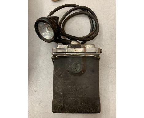 A VINTAGE MINERS LAMP AND BATTERY 