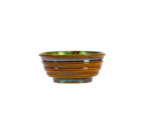 ZSOLNAY PECS EOSIN MINIATURE BOWL, the lustrous green interior decorated with stylised flora, with ribbed exterior, marks to 