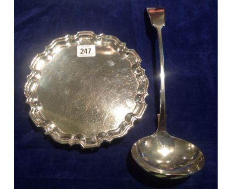 PEARCE & SONS, AN ENGLISH SILVER CARD TRAY Supported on scroll feet, along with an E.P.N.S. silver soup ladle. (32cm)