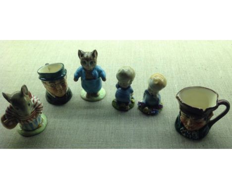 A PAIR OF BESWICK BEATRIX POTTER FIGURES Including Mrs Tittlemouse and Tom Kitten, along with two Wade figures and two Doulto