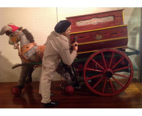 A LARGE EARLY 20TH CENTURY CONTINENTAL 'LA CIBELES' AUTOMATON Modelled as an organ grinder standing alongside a donkey, playi