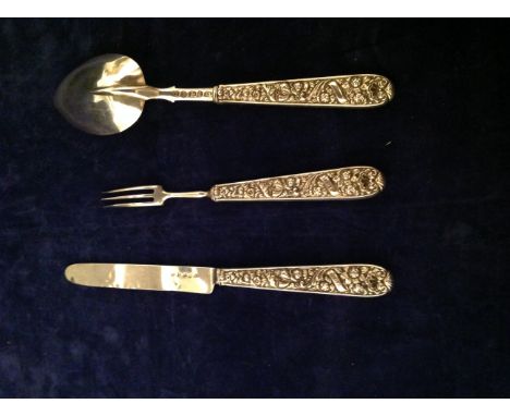 AN 18TH CENTURY ENGLISH SILVER FORK AND SPOON Embossed with scrolling flowers and hallmarked Birmingham, 1795, bearing makers