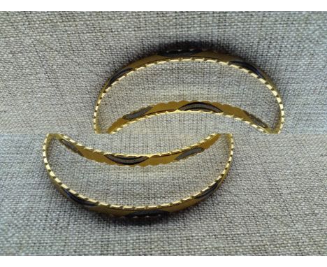 A COLLECTION OF FOUR (TWO PAIRS) INDIAN 22CT GOLD BANGLES Hallmarked 'BR22C' and '22CT 5NL', applied with black enamel decora