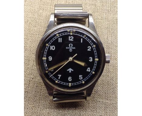 AN OMEGA 1953 R.A.F. MILITARY ISSUE PILOT'S WATCH Having a fat arrow and circle T on dial and inscribed to reverse '6645 1010