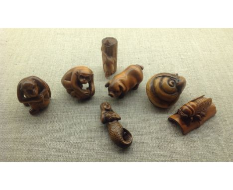 A COLLECTION OF SEVEN 20TH CENTURY JAPANESE ORIENTAL NETSUKE CARVINGS Made from tagua nuts, each signed by sculptor. (approx 