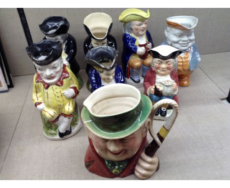 A COLLECTION OF SEVEN 19TH CENTURY AND LATER TRADITIONAL TOBY JUGS To include 'Punch', 'The Snufftaker' etc, together with a 