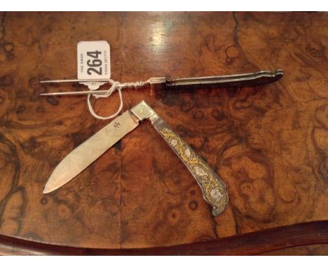 AN 18TH CENTURY GERMAN STEEL TRAVELLING FOLDING KNIFE AND FORK The handles having champlevé decoration in parcel gilt and dep