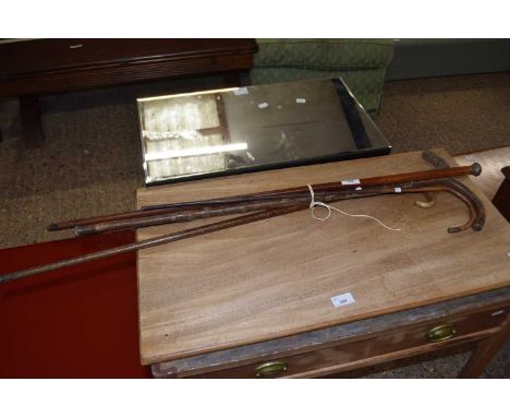 Collection of five various walking sticks to include silver banded examples