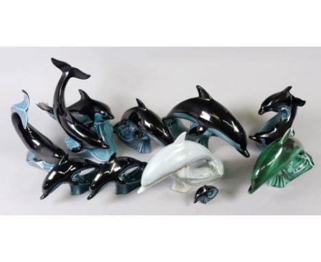 A collection of eight Poole Pottery figures of dolphins and two groups of two dolphins, mostly dolphin blue (10).