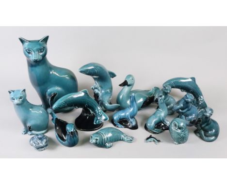 A collection of sixteen dolphin blue Poole Pottery figures of animals including two cats, one 28cm high, fish, ducks, owl, se