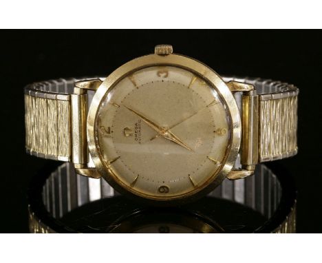 A gentlemen's 9ct gold Omega automatic strap watch, c.1955,on a later expanding bracelet.  The case, 35mm diameter, with a si
