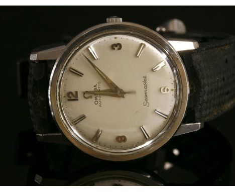 A gentlemen's stainless steel Omega Seamaster Automatic strap watch, c.1963,circular case, 34mm diameter, with a silvered dia