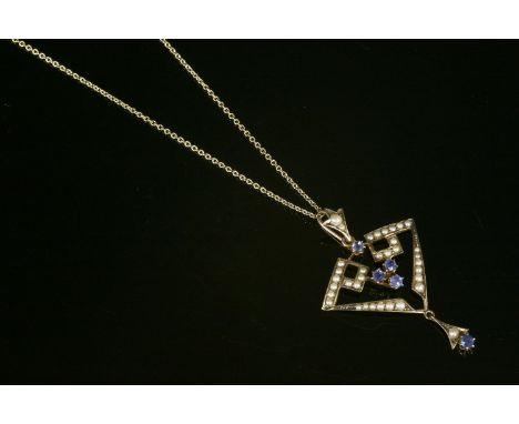 An Edwardian pendant gold sapphire and split pearl openwork pendant,on a 9ct gold chain.  3.58g