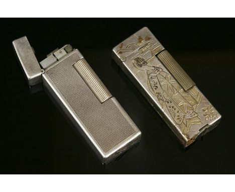 An Asian silver Aesthetic Movement lighter,with an incised and gilded geisha against a pagoda with Mount Fuji and prunus to t