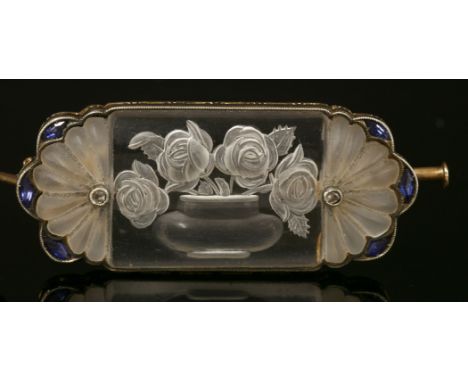 A Continental rock crystal, sapphire and diamond plaque brooch, c.1920, with a polished rectangular rock crystal plaque to th