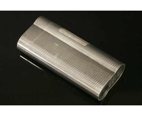A cased silver plated Dunhill lighter,of rounded form with a pinstripe decoration and Rolls Royce logo to the lid.  Original 