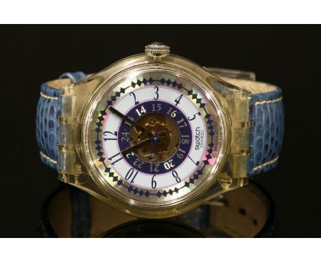 A gentlemen's Swatch Automatic strap watch, with skeleton back, printed navy and pale blue dial, open circular centre with or