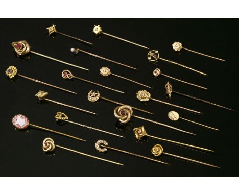 A collection of stick pins,to include:a cased gold single stone sapphire twisted knot stick pin, head marked 15ct, stick test