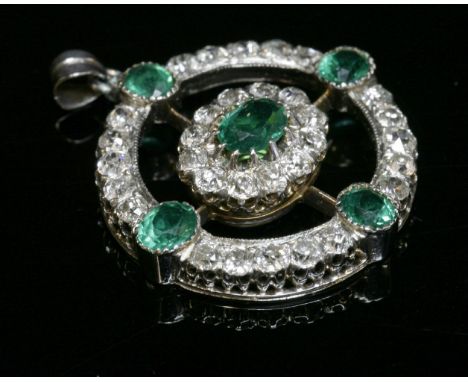 A late Victorian emerald and diamond circular target-style pendant, c.1890,a central oval cluster, composed of an oval mixed 