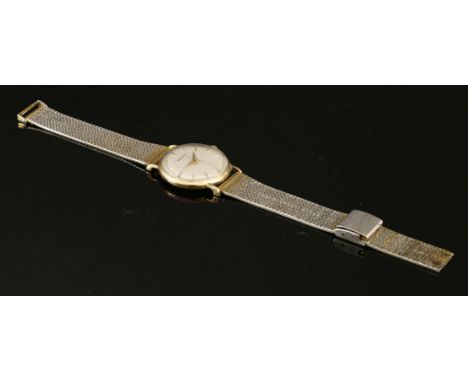 A gentleman's 9ct gold Jaeger LeCoultre mechanical watch,on a later gilt metal bracelet.  Circular case, 33mm diameter, with 
