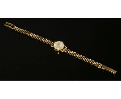 A ladies' 18ct gold Favre Leuba mechanical bracelet watch, on a later 9ct gold bracelet.  A circular silvered dial with gilt 