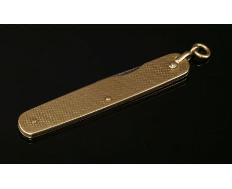 A 9ct gold Asprey & Co. gold cased penknife, the case with engine turned decoration, two steel blades, London 1923, 14.17g, a