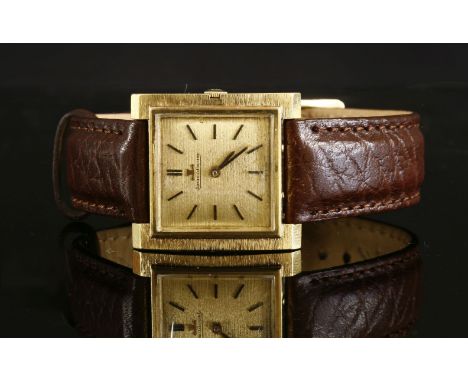 A gentlemen's 18ct gold Jaeger-LeCoultre mechanical strap watch, c.1970,square bark textured case, with a square bark texture