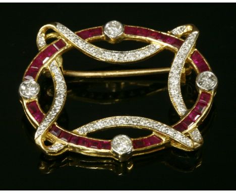An 18ct gold, ruby and diamond oval hoop brooch,with a single row of calibré-cut rubies, channel set to a yellow hoop, with a
