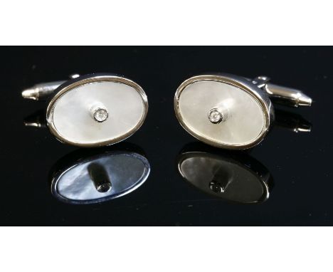 A pair of Italian white gold diamond and mother-of-pearl cufflinks,with a brilliant cut diamond, rub set to a plain collet at