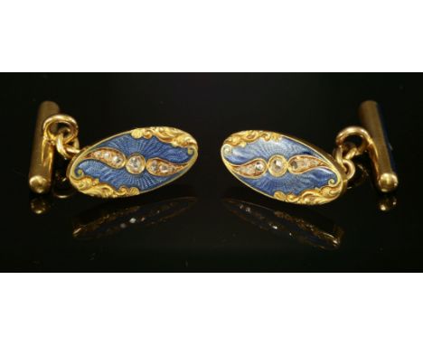 A pair of cased, gold, enamel and diamond set cufflinks, c.1915,with a flat section oval head, grain set with a diagonal row 