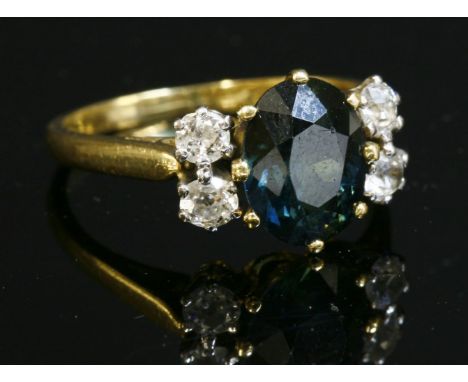 A green sapphire and diamond ring,with an oval mixed cut sapphire, claw set to the centre in a yellow collet.  A pair of old 