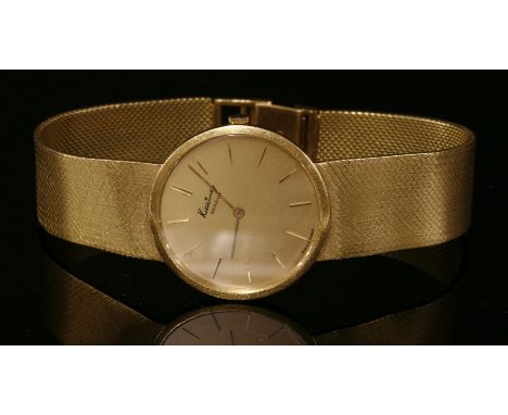 A gentlemen's 18ct gold Kutchinsky Genève mechanical bracelet watch, c.1970,a circular case with champagne dial, damage, rais