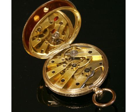 A gold Swiss key wound fob watch, c.1860,36mm diameter.  A gold chased and engine turned dial with hand engraved bezel, and c