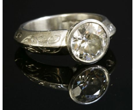 A platinum single stone diamond ring,with an old brilliant cut diamond, with a known weight of 2.07ct, rub set to a tapered c