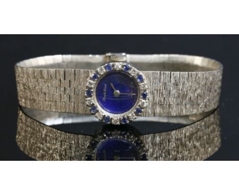 A ladies' 9ct white gold sapphire and diamond set Beuche Girod mechanical watch, c.1970,with a circular lapis lazuli dial.  A