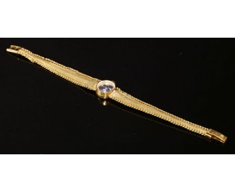 A ladies' 18ct gold Omega Le Locle mechanical bracelet watch, c.1950,a circular black Florentine dial with raised silver bato