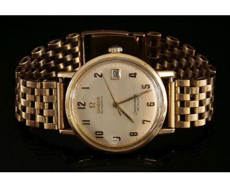 A gentlemen's 9ct gold Omega Seamaster de Ville automatic watch, on a later 9ct gold bracelet.  Circular case 34mm diameter w