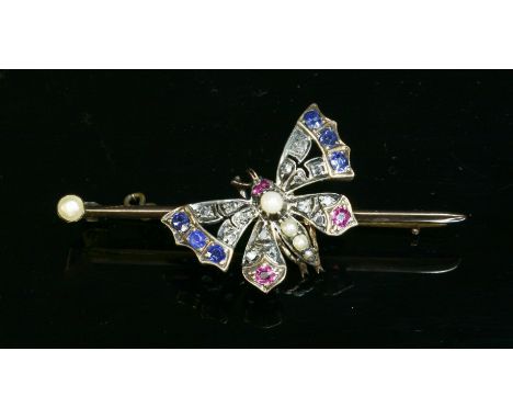 A split pearl, diamond, ruby and sapphire butterfly brooch, c.1900,with an openwork butterfly, grain set with split pearls to