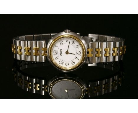 A ladies' bi-colour Hermès Profile Quartz bracelet watch,with a circular white dial with black Arabic numerals, hands, and da