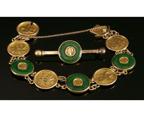 A Chinese jade bracelet,with three jade bi, each one rub set in a plain frame with raised Chinese characters to the centre, a