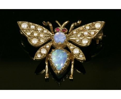 A 9ct gold, opal, ruby and cultured pearl moth or butterfly brooch, the thorax and abdomen composed of a pear shaped and circ