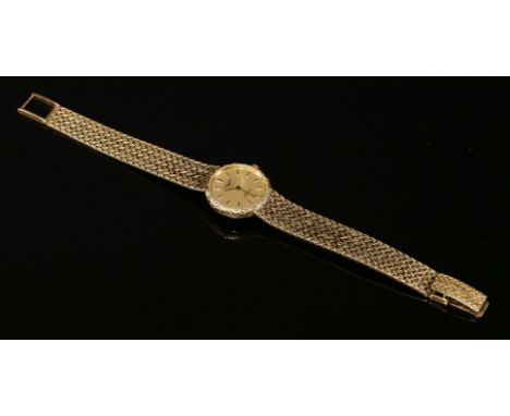 A ladies' 9ct gold Longines Presence quartz bracelet watch, with circular case, champagne dial, raised gilt batons and hands.