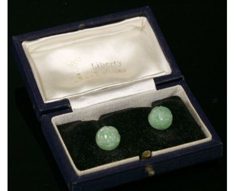 A pair of 9ct white gold jade stud earrings by Cropp & Farr, c.1960,each carved jade half bead, cup and peg set to white cup 