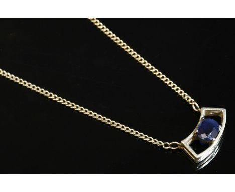 An Italian gold single stone sapphire pendant necklace, c.1970,a single oval cut sapphire, claw set to a curved open frame tr