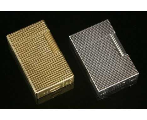 A gold-plated Dupont lighter,with hobnail decoration, no. 9927 DN, anda silver-plated Dupont lighter,with fine hobnail decora