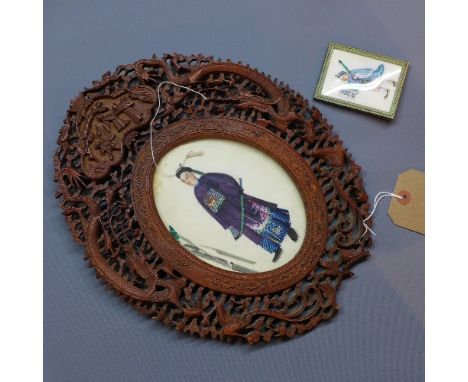 A 19th century Chinese rice paper painting of warrior, within a 19th century carved oval frame, with pierced decoration depic