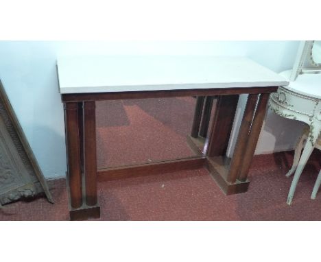 An Empire style mahogany console table with mirrored back and limestone top, H. 92cm W. 117cm D. 43cm