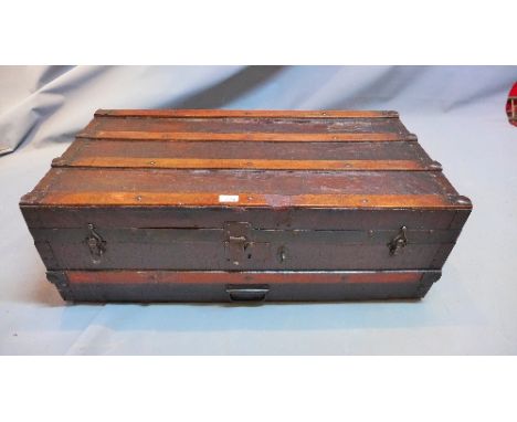 A Louis Vuitton style oak wrought iron bound trunk. H-32cm, W-92cm 